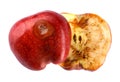 Halved rotten apple is isolated against a white background. Full clipping path. The red apple is spoiled