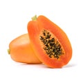 Halved and whole papaya fruits