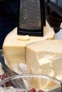 halves of the cheese heads on the counter with a grate