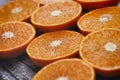 Halves of citrus background. Cut fresh fruits. Royalty Free Stock Photo