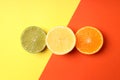 Halves of citrus fruits on two tone background Royalty Free Stock Photo