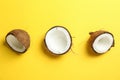 Halves coconut on color background