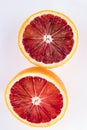 2 halves of a cut blood orange isolated on white Royalty Free Stock Photo