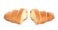 Halves of delicious croissant with cream on white background