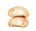 Halves of delicious croissant with cream on white