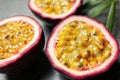 Halves of passion fruits maracuyas on table, closeup