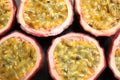 Halves of passion fruits maracuyas on table, flat lay Royalty Free Stock Photo