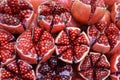 Halves of pomegranates with seeds sold in the local market of Bangko