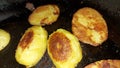 Halves of potatoes in a pan. Vegan and vegetarian food.