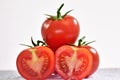 Halves and whole red tomatoes Royalty Free Stock Photo