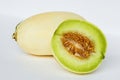 Halves of yellow melon cantaloupe fruit on white background. cut ripe sweet honeydew green melon