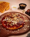 Halwa Waffle with nuts, walnut, almond, pistachio served in dish isolated on table top view of cafe waffles food dessert Royalty Free Stock Photo