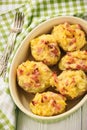 Ham and cheese jacket potatoes on dark background.