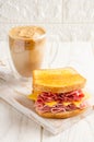 Ham, cheese and salami sandwich with coffee with milk Royalty Free Stock Photo