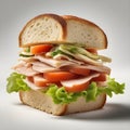 A ham, cheese, tomato, and lettuce sandwich on white bread Royalty Free Stock Photo