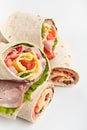 Ham and Cheese Wraps cut in half on white ba Royalty Free Stock Photo