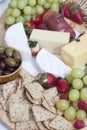 Ham, chips and crackers, olives, grapes, strawberries and cheese Royalty Free Stock Photo