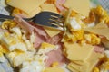 Ham and eggs. Healthy breakfast. Scrambled eggs and ham and cheese.