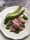 Ham with melon is a classic, cold, Mediterranean appetizer dish.