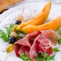 Ham with melon and olives Royalty Free Stock Photo