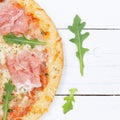 Ham pizza prosciutto from above copyspace copy space square close up on wooden board