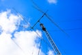 Ham radio antenna against cloudy sky Royalty Free Stock Photo