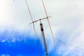 Ham radio antenna against cloudy sky Royalty Free Stock Photo