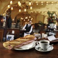 Ham sandwich and a cup of coffee on the bar Royalty Free Stock Photo