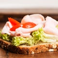 Ham sandwich with tomato closeup Royalty Free Stock Photo