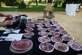 Ham slicer. Detail of the hand cutting slices of Spanish Iberian ham and set of dishes ready to be served in catering