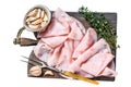 Ham Thin sliced on wooden cutting board with herbs. Isolated on white background, top view. Royalty Free Stock Photo