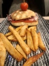 Ham and tomato panini served with french fries Royalty Free Stock Photo