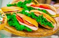 Ham, tomatoes sandwiches and lettuce leaves Royalty Free Stock Photo