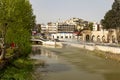 Hama cityscape featuring the Orontes river and arched stone bridge over it. Royalty Free Stock Photo