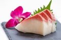 Hamachi Sashimi : Sliced Raw Hamachi Yellowtail Fish Served with Sliced Radish on Stone Plate Royalty Free Stock Photo