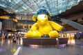 Hamad Airport, Quatar - July 9, 2021: Giant yellow teddy bear installation in Hamad International Airport duty-free hall