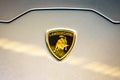 Hamad Airport, Quatar - July 9, 2021: Lamborghini gold bull logo on a silver car