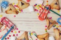 Hamantaschen cookies and candy background. View from above