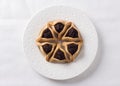 Hamantashen cookies or Aman ears, triangular cookies with poppy seeds and raisins