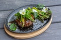 Hambagu Hamburger Steak with asparagus and green onion served on a cast iron pan Royalty Free Stock Photo