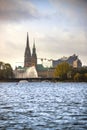 View of the old town in Hamburg behind aussenalster lake, Germany