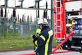 Hamburg, Germany - April 18, 2013: HDR - firefighter chief in action near the fire engine