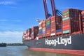 Hamburg, Germany, August 3, 2022: Hapag-Lloyd container vessel shipping international freight on the cargo port of Hamburg on the