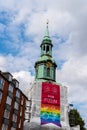 Holy Trinity Church in St. Georg quarter with gay flag in the tower in Hamburg