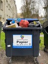 Hamburg-Germany-February 1 2020: a paper trash can filled with different waste