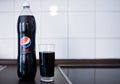 Hamburg, Germany 01.18.2018 illustrative editorial of PET bottle of Pepsi Max with filled drinking glass