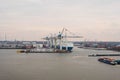 Hamburg. View of the city port with ships and docks, cargo cranes and warehouses Royalty Free Stock Photo