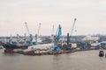 Hamburg. View of the city port with ships and docks, cargo cranes and warehouses