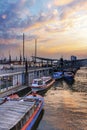 Small boats docked at St. Pauli`s Piers or LandungsbrÃÂ¼cken in evening