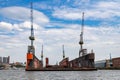 Hamburg, Germany - July 25, 2022, Alster - Port with shipyards, cranes, logistic facilities and messengers from Hamburg in Germany Royalty Free Stock Photo